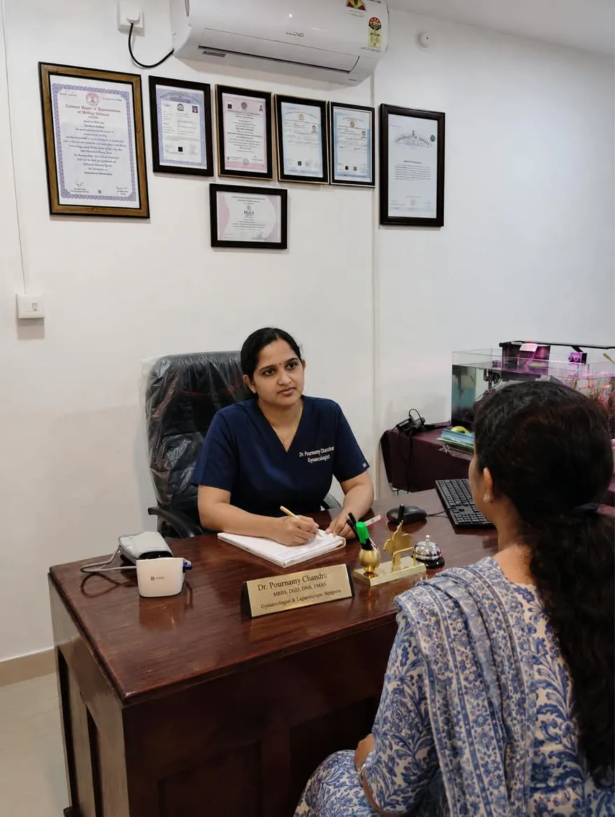 Dr. Pournamy consulting a patient at her clinic